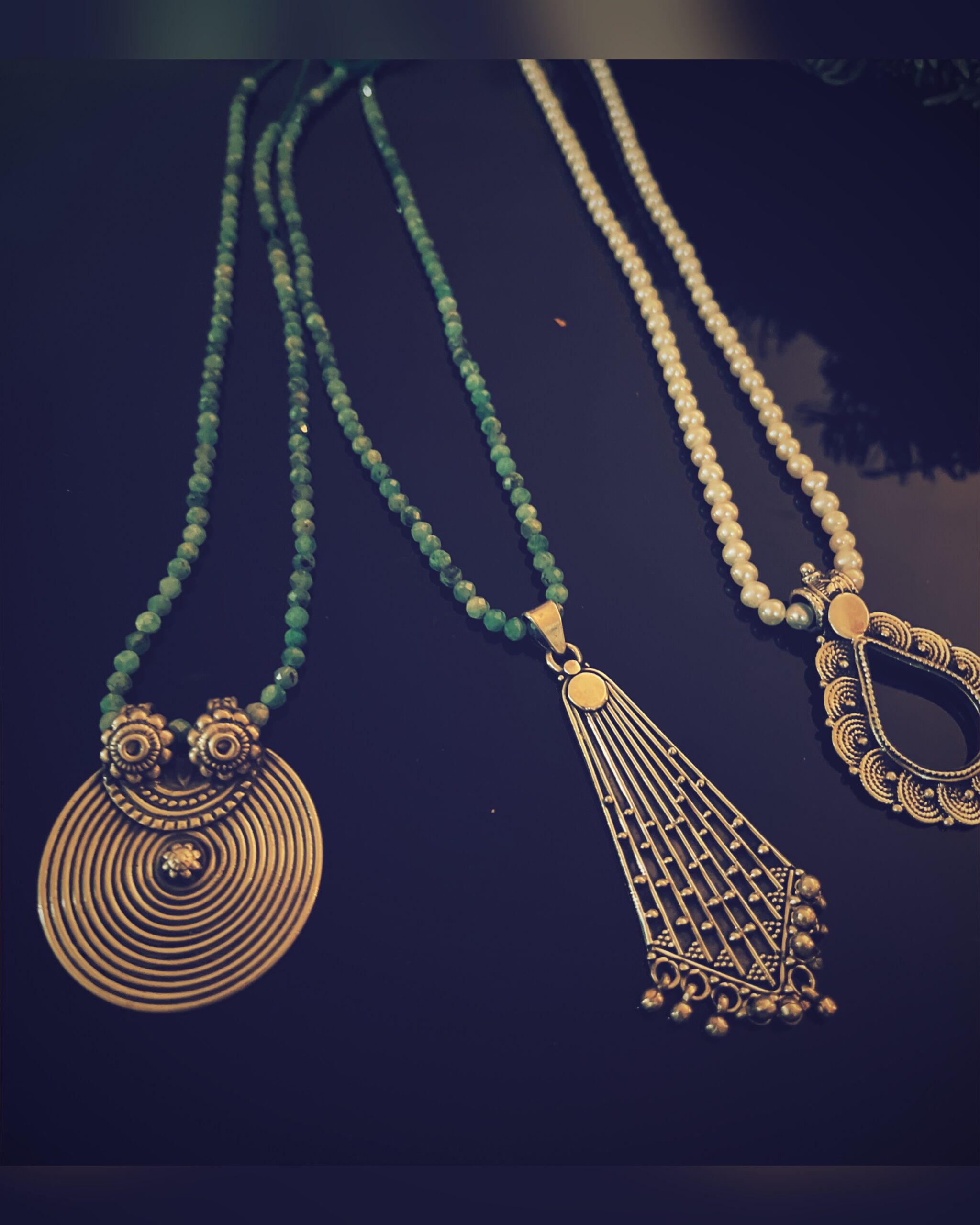 Raw elegance. Tribal rhythm. Feminine instinct. Amorepiattu presents “Résonance” — a bold collection born from the embrace of the earth and the artistry of the hand. These statement necklaces feature noble materials: bamboo beads, natural stones, and metallic chains that dance along the neckline like a whispered poem of wild beauty. Each piece is handmade, unique, and evocative. The green stones recall forest canopies; the golden bamboo, sun-warmed soil; the metallic accents, the timeless whisper of ancestral craftsmanship. For Her, for Him, for the Now. Amorepiattu – Handcrafted treasures, where elegance meets essence.